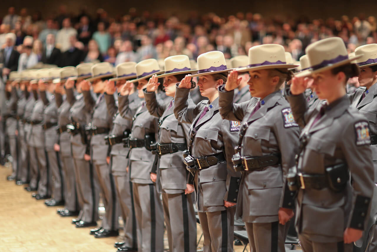 Female Troopers standing in rows saluting